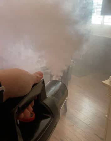 Technician preparing thermal fogging solution